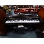 Yamaha Clavinova CLP 150 with owners manual and stool