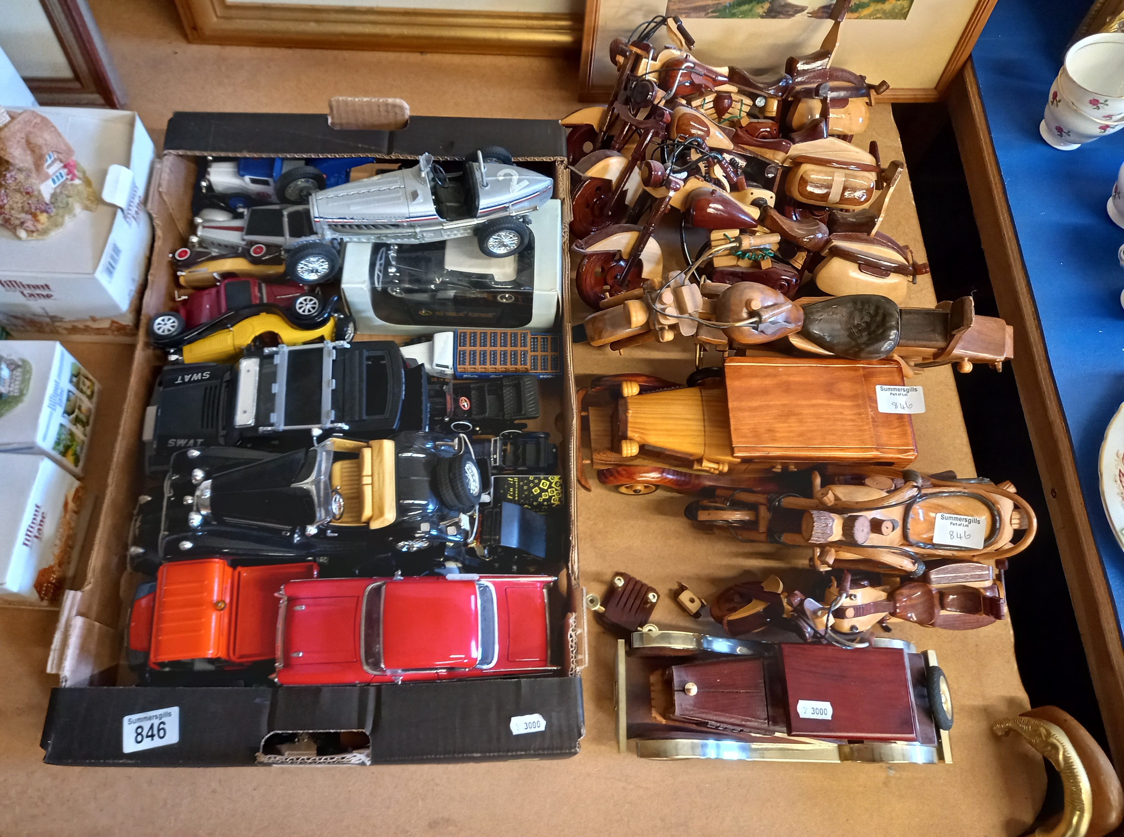 A Box of Tin Plate Cars with others and a collection of Wooden Motorcycles