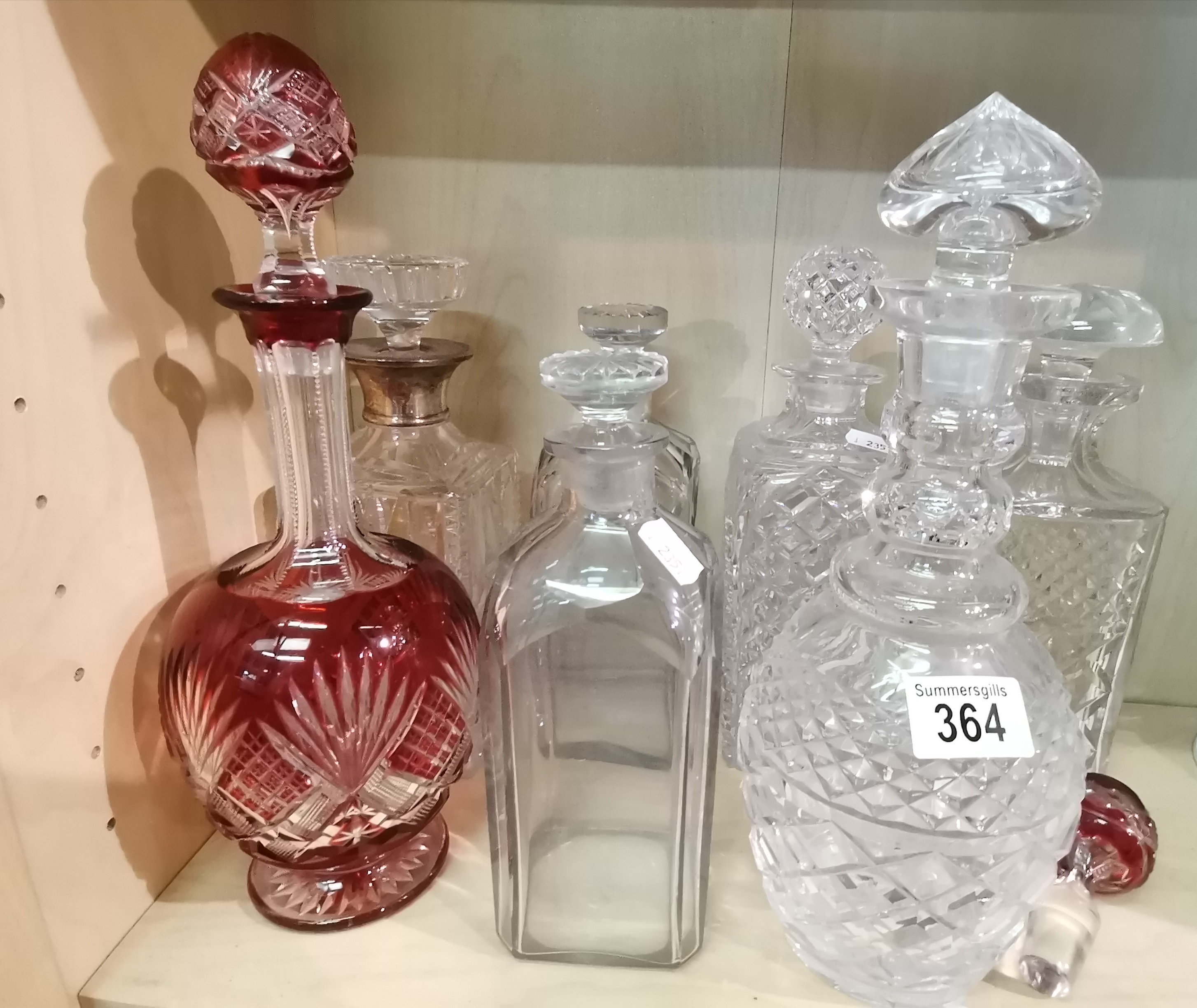 A collection of cut Glass Decanters including Cranbury Glass one