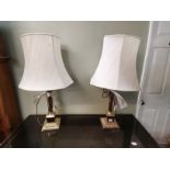 A pair of 50cm brass Corinthian column table lamps and a matching standard lamp