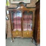 An Edwardian mahogany with inlaid decoration displ