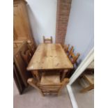 Pine kitchen table and 6 reed seated chairs