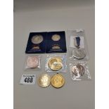 A collection of coins, tokens and medallions