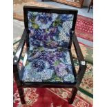 Floral armchair with wooden frame