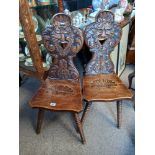 Pair of greenmail oak carved hall chairs with bobbin turned legs ( split on both seats )