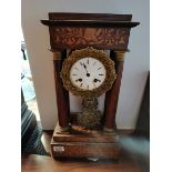 French inlaid Portio Mantle Clock - Damage to face and rear foot. Hand missing. With Key