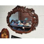Wall mirror in wooden frame