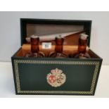 Set of 3 brown glass decanters in leather box