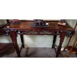 A Chinese hardwood altar table with shaped ends an