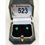 A pair of single stone Emerald stud earring set in 18ct White gold