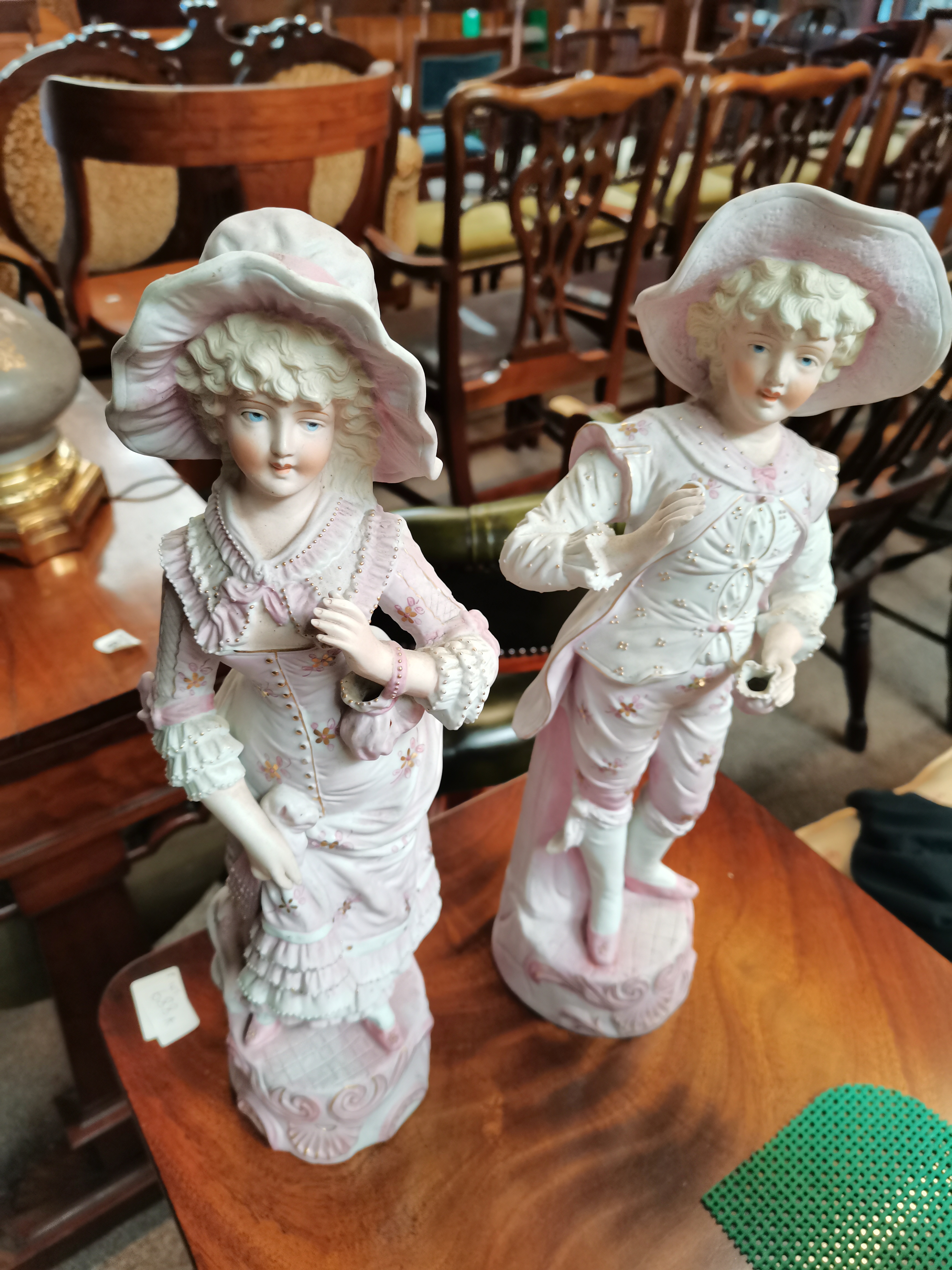 A pair of Victorian large bisque figures