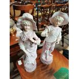 A pair of Victorian large bisque figures