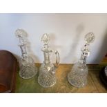 A trio decanter set possibly Waterford Crystal with bell shape bases