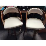 A pair of Art Deco style stools with cream leather