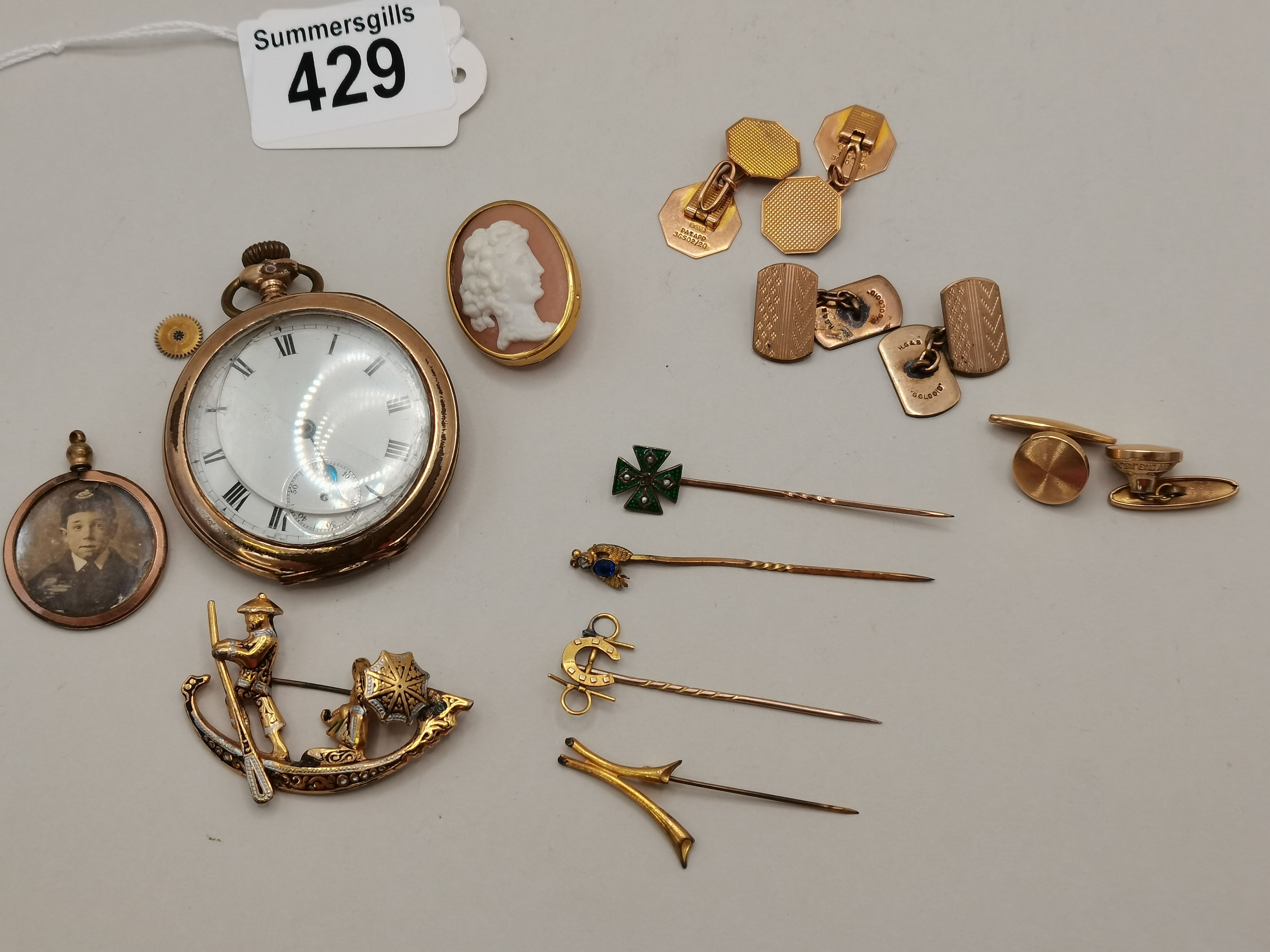 A collection of yellow metal and Gold items including cuff links, brooch, pins etc