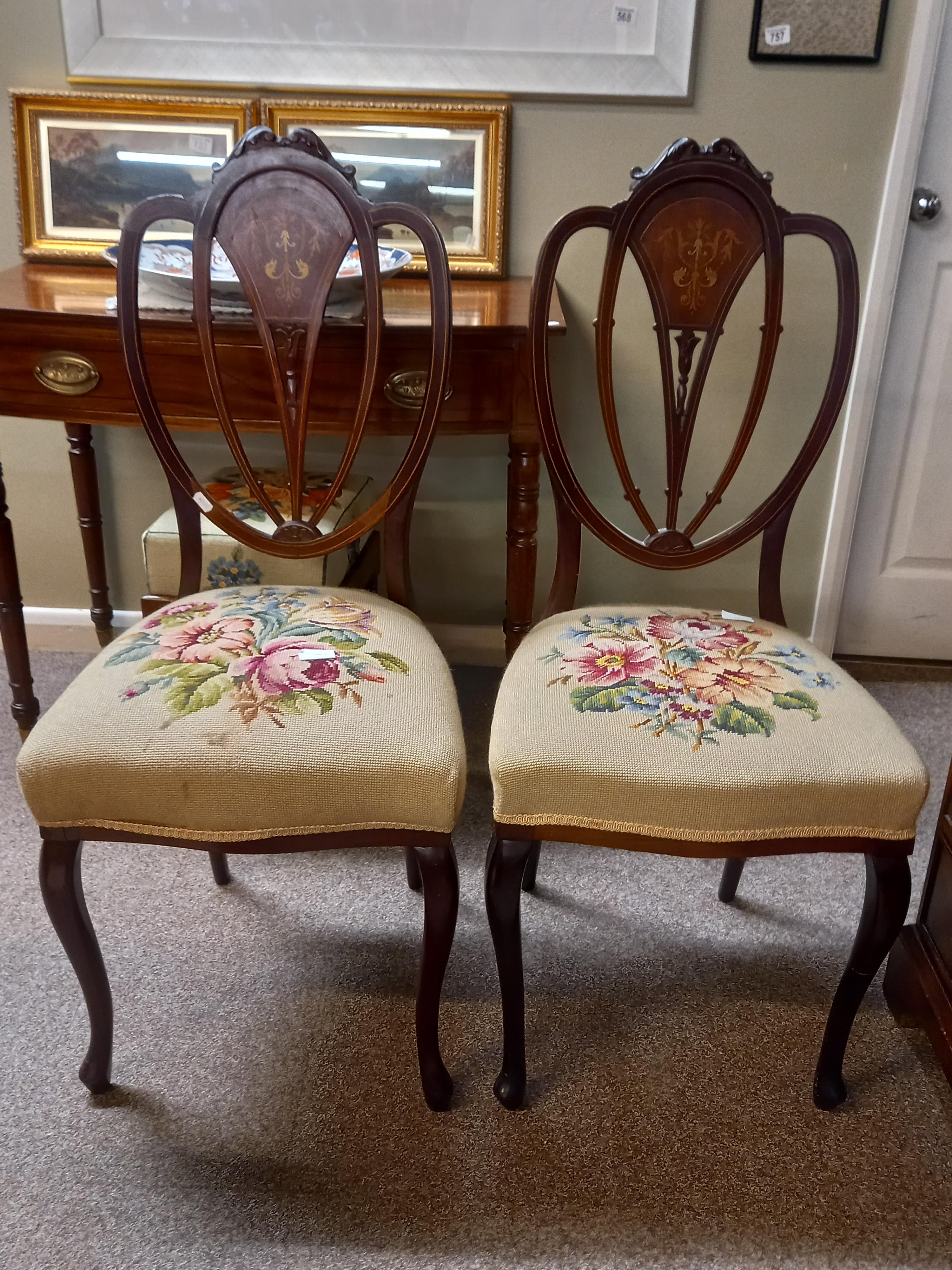 A pair of Edwardian inlaid hall chairs