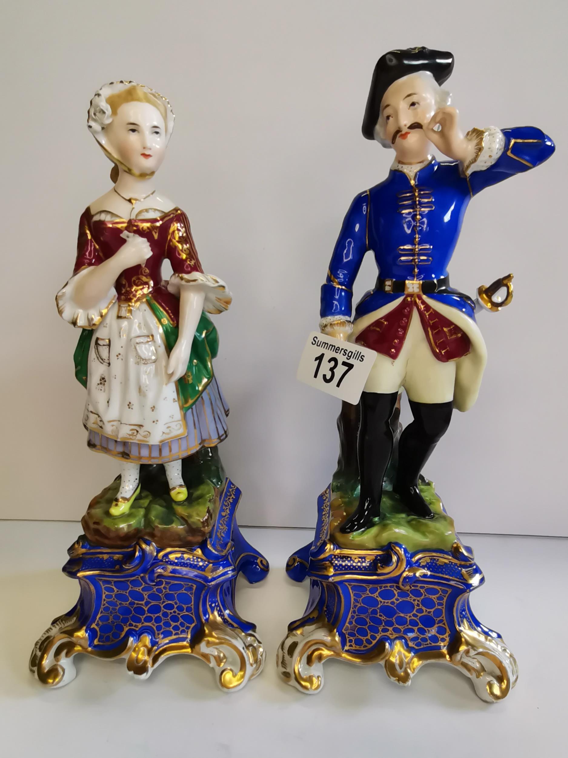 Man and Woman in old continental dress on blue and gilt base