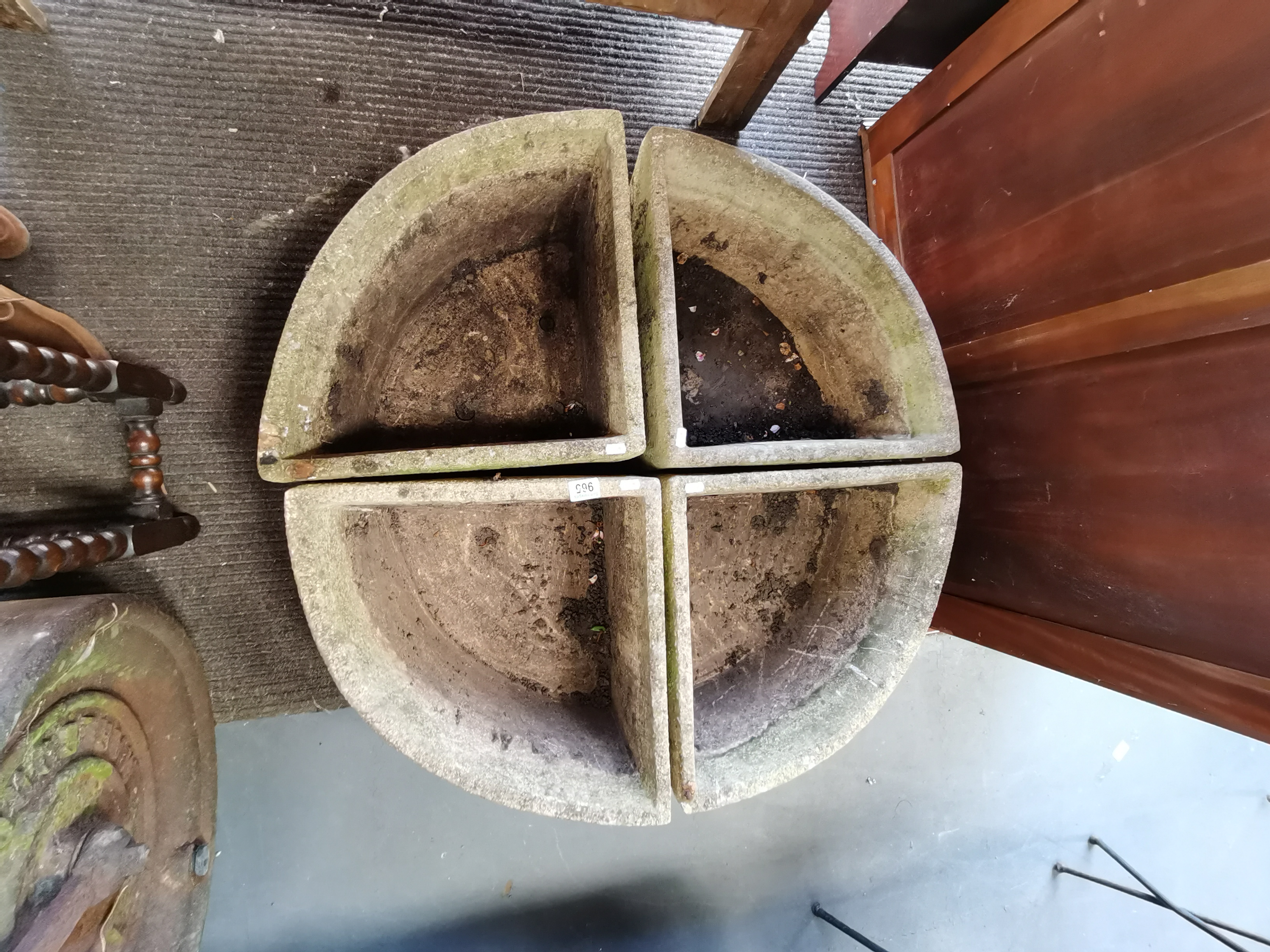 Circular stone garden trough in four quarter sections