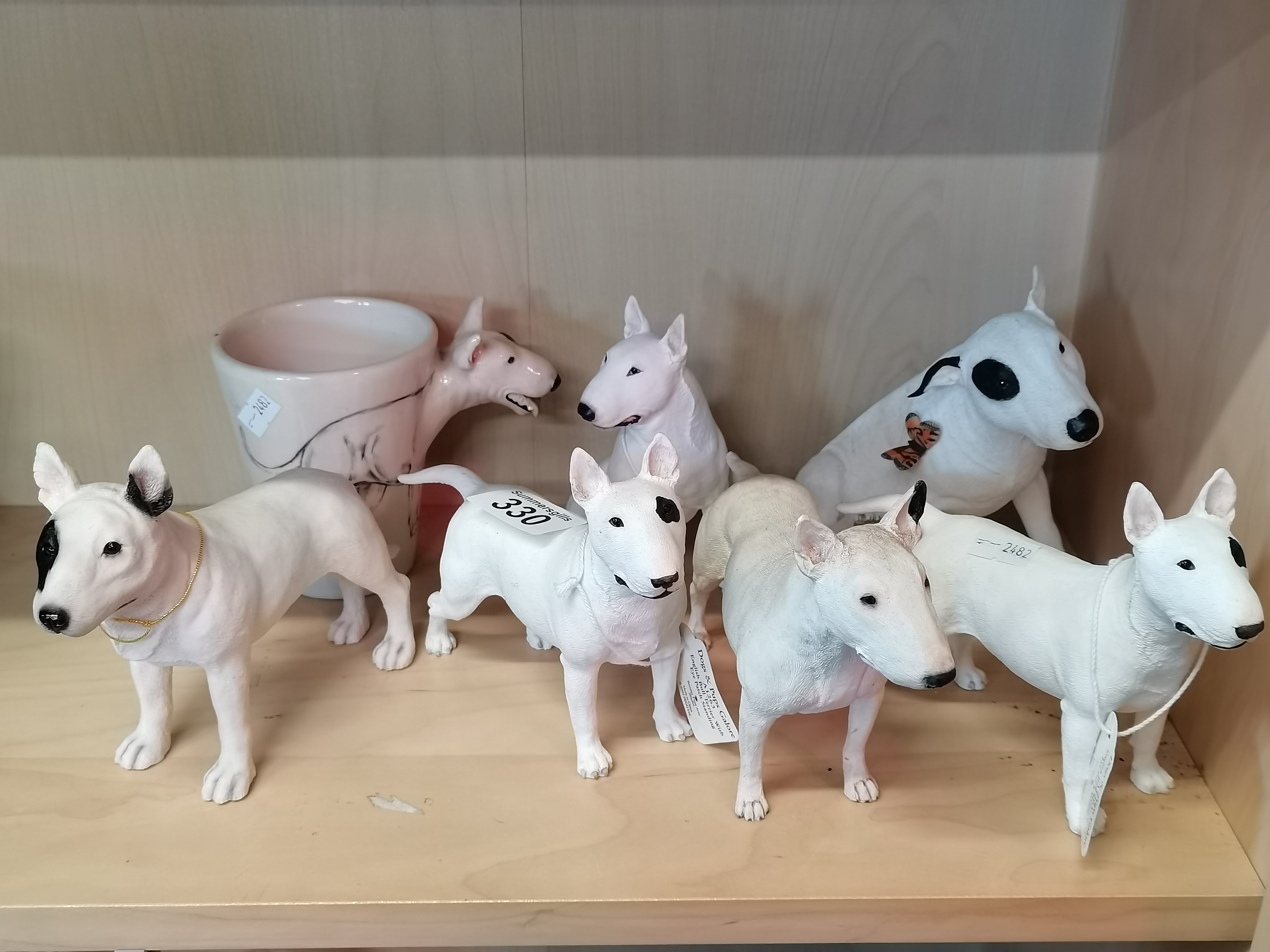 A collection of English Bull Terrier figurines including Border Fine Arts