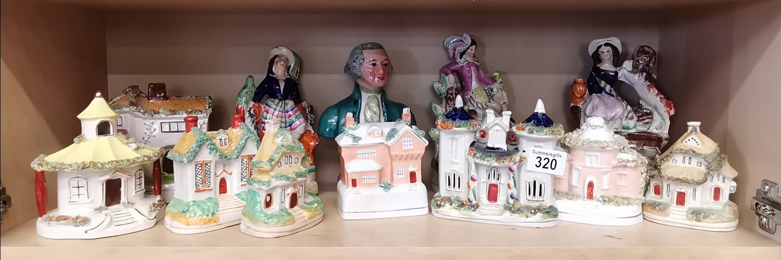 A large collection of Staffordshire Houses and figurines