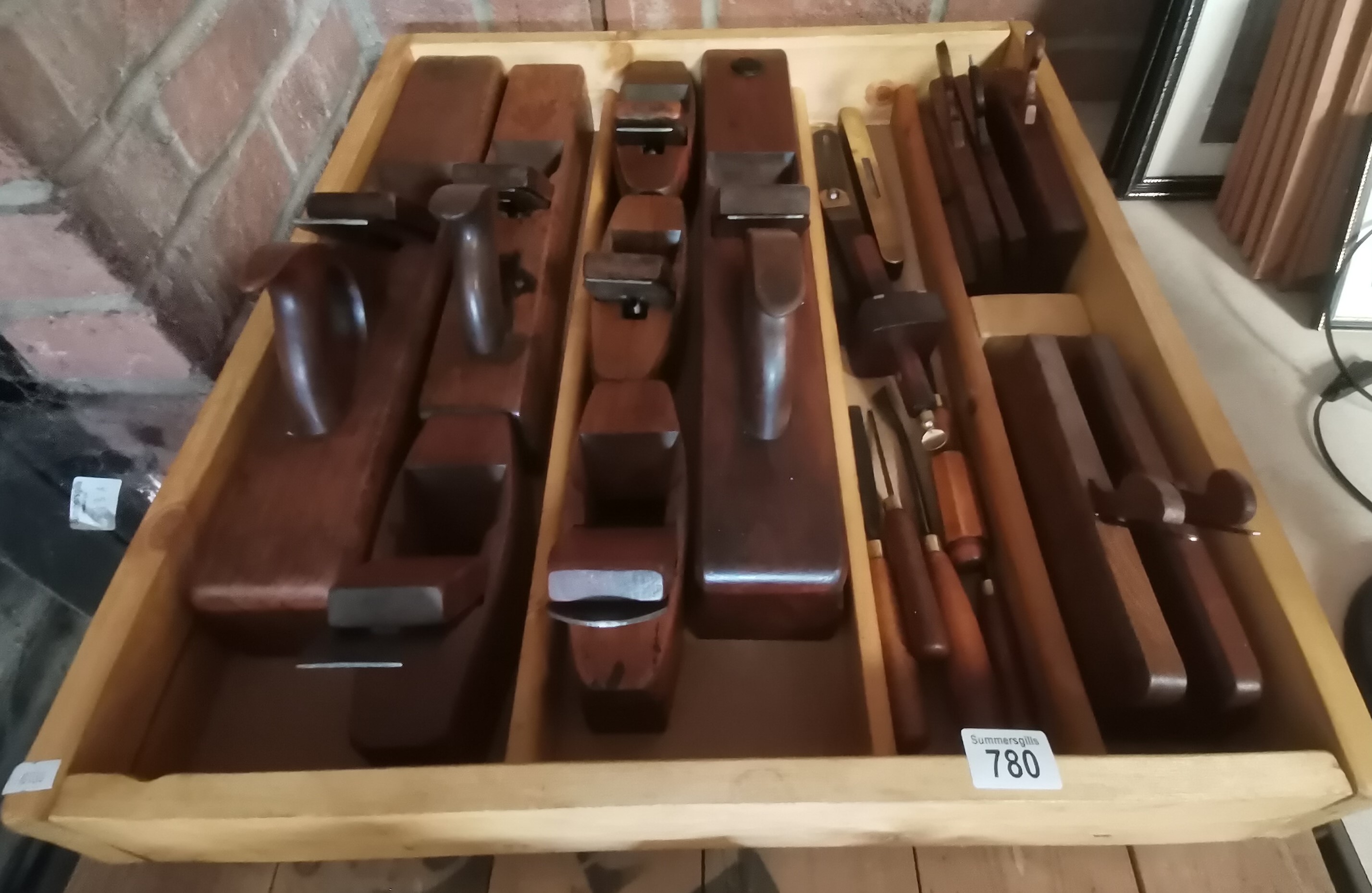 Large box of woodworking planes and tools