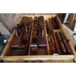 Large box of woodworking planes and tools