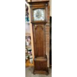 An excellent oak grandmother clock with silvered dial standing 6ft approx