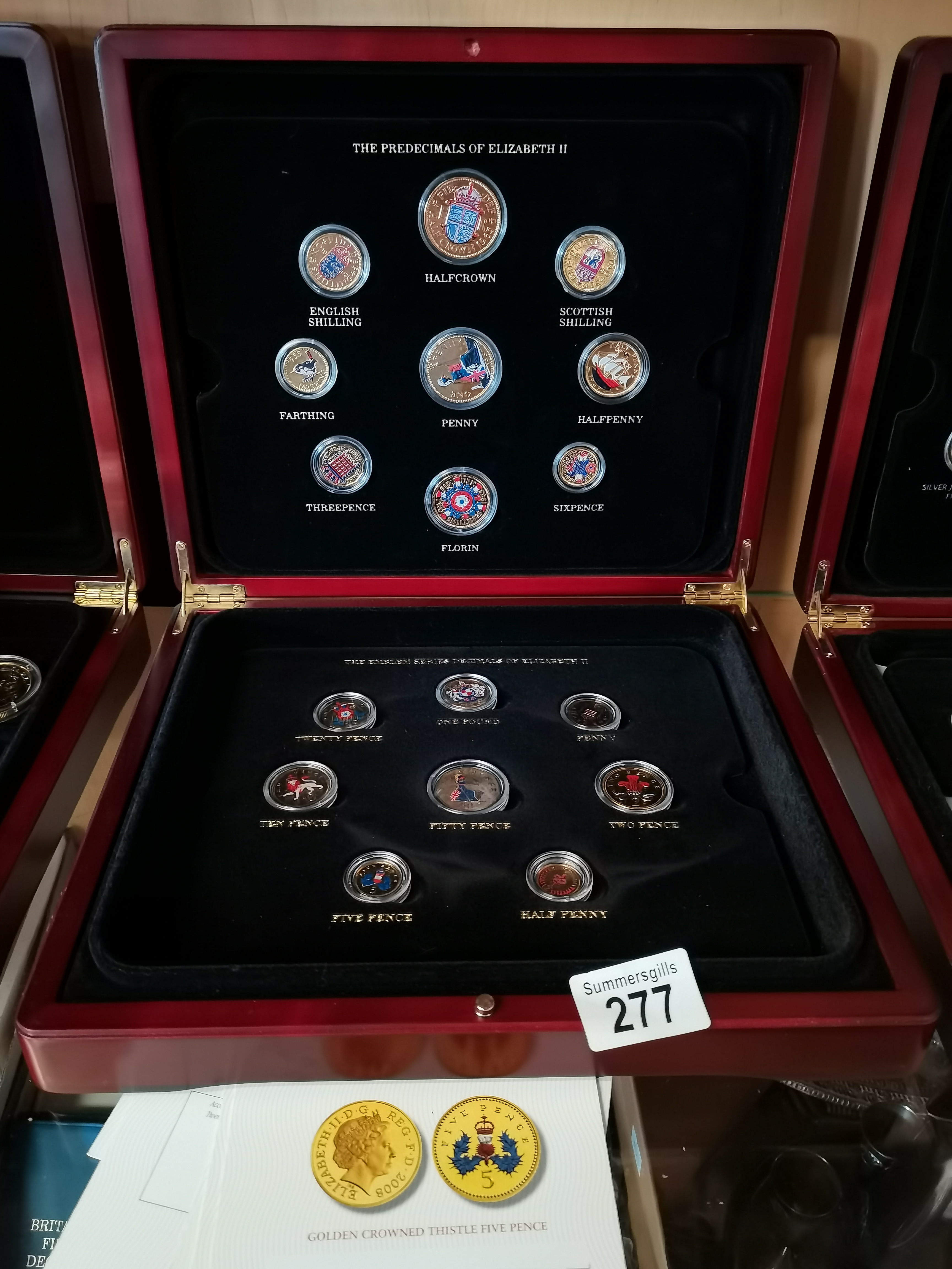 A collection of Elizabeth II coins Gold plated with certificates and original box