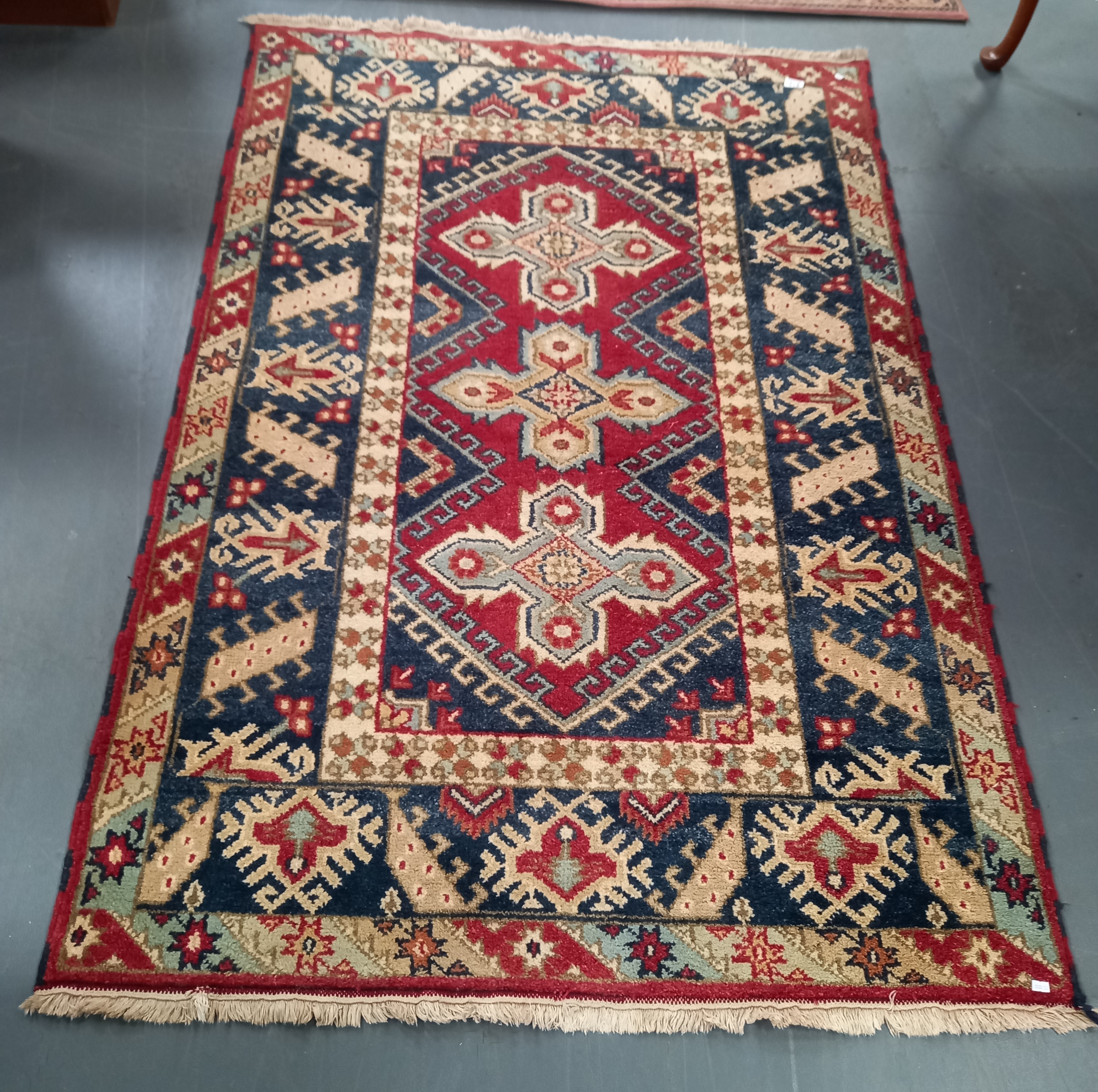 100% wool Indian Rug red, blue and cream deep pile