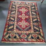 100% wool Indian Rug red, blue and cream deep pile