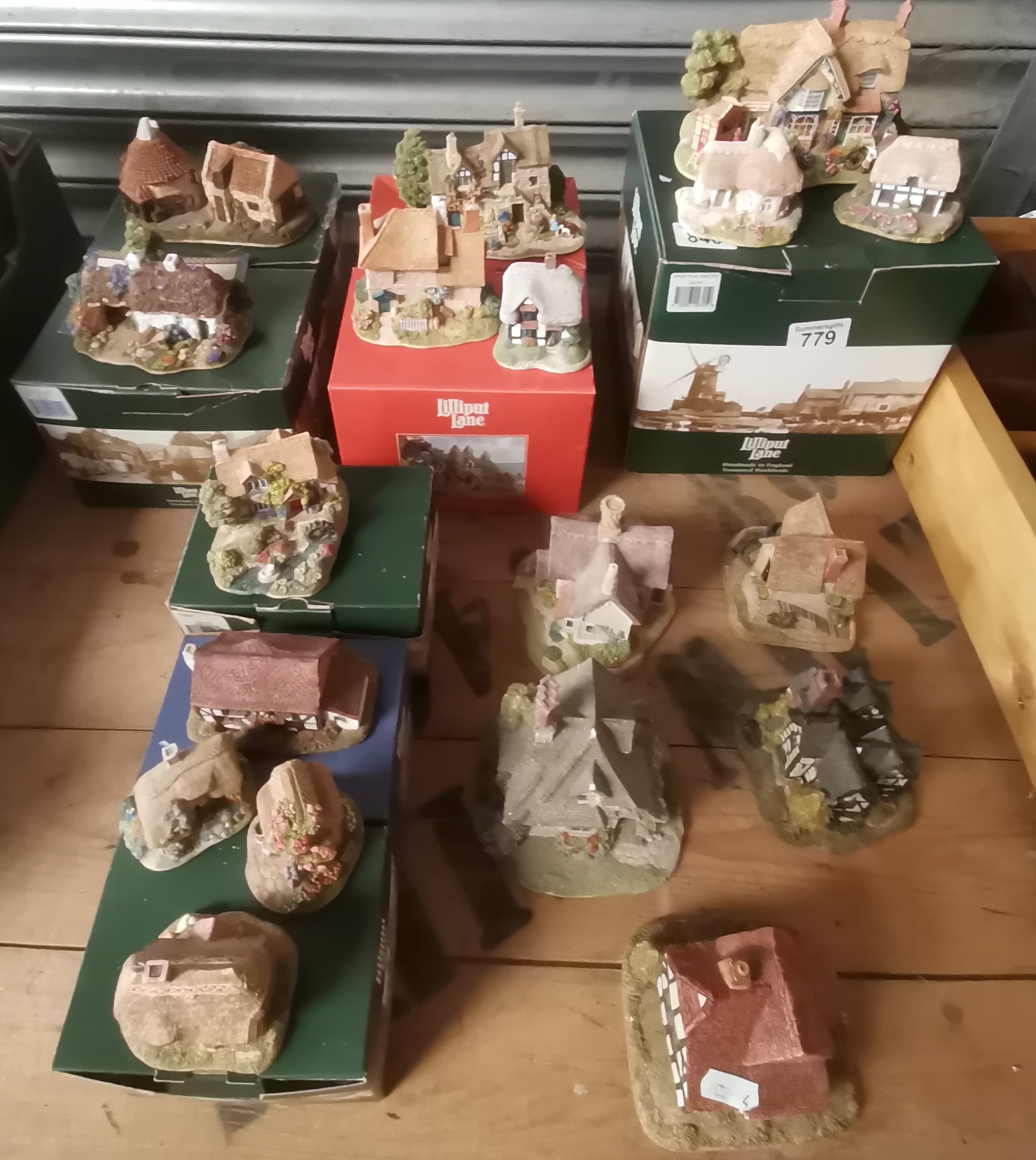 18 lilliput lane cottages, some with boxes