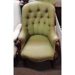 A Victorian arm chair with cabriole legs