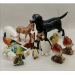 A collection of porcelain animals including Beswick