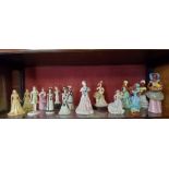 A collection of porcelain ladies including Wedgewood and Coalport,