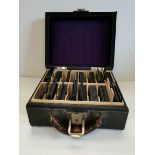 A collection of glass magic lantern slides in leather case