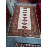 Cream and red Afgan rug