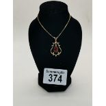 A 9ct gold and ruby necklace 5g