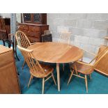 A lovely Blonde Ercol drop leaf dining table with 4 chairs