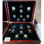 A collection of Elizabeth II coins Gold plated with certificates and original box
