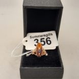 A gold with amber ring size P