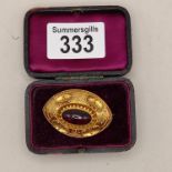 Large gold brooch with centre red stone 13grams