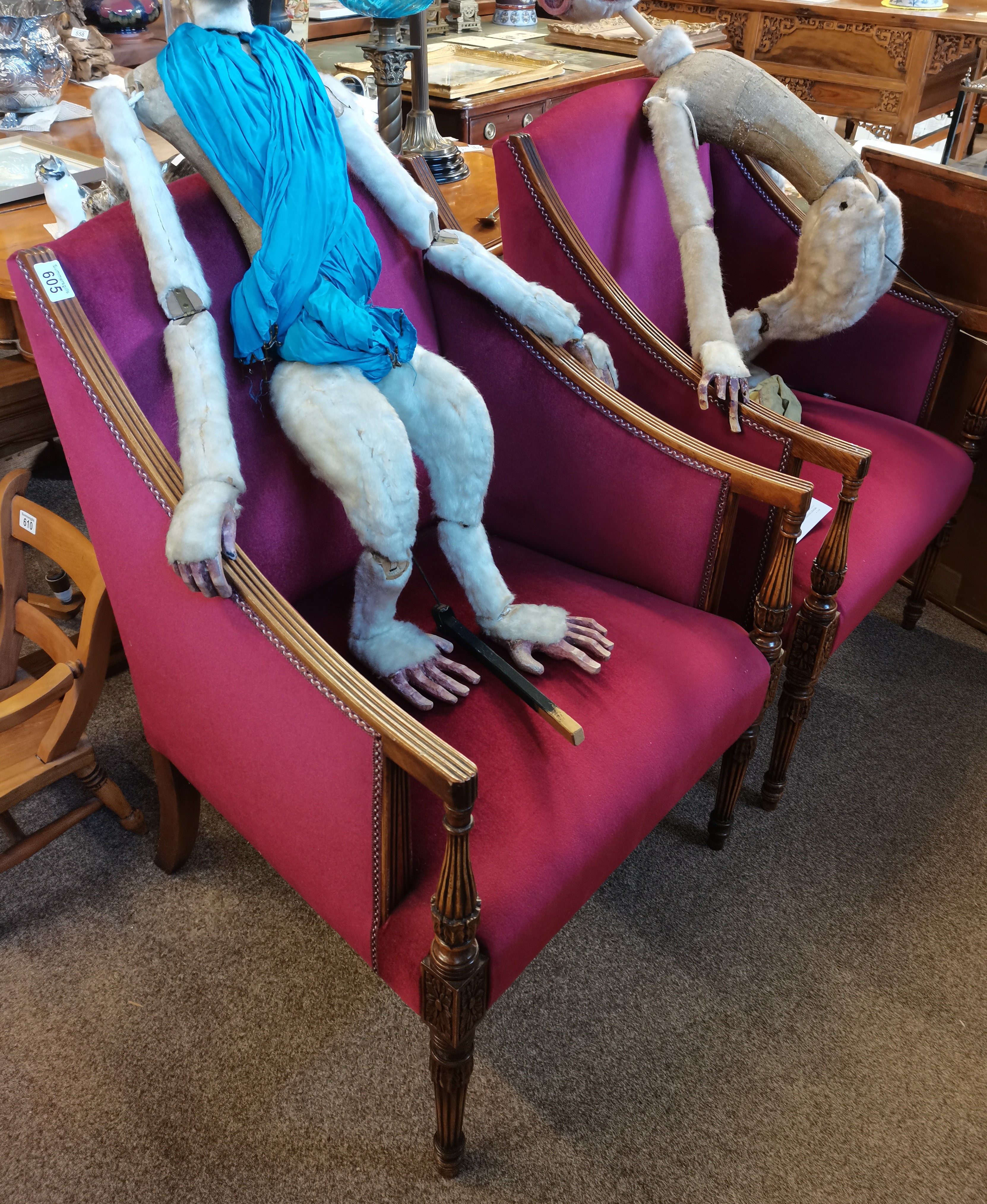 A pair of 20th century mahogany arm chairs with reeded legs
