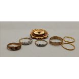 x6 gold rings and a Brooch