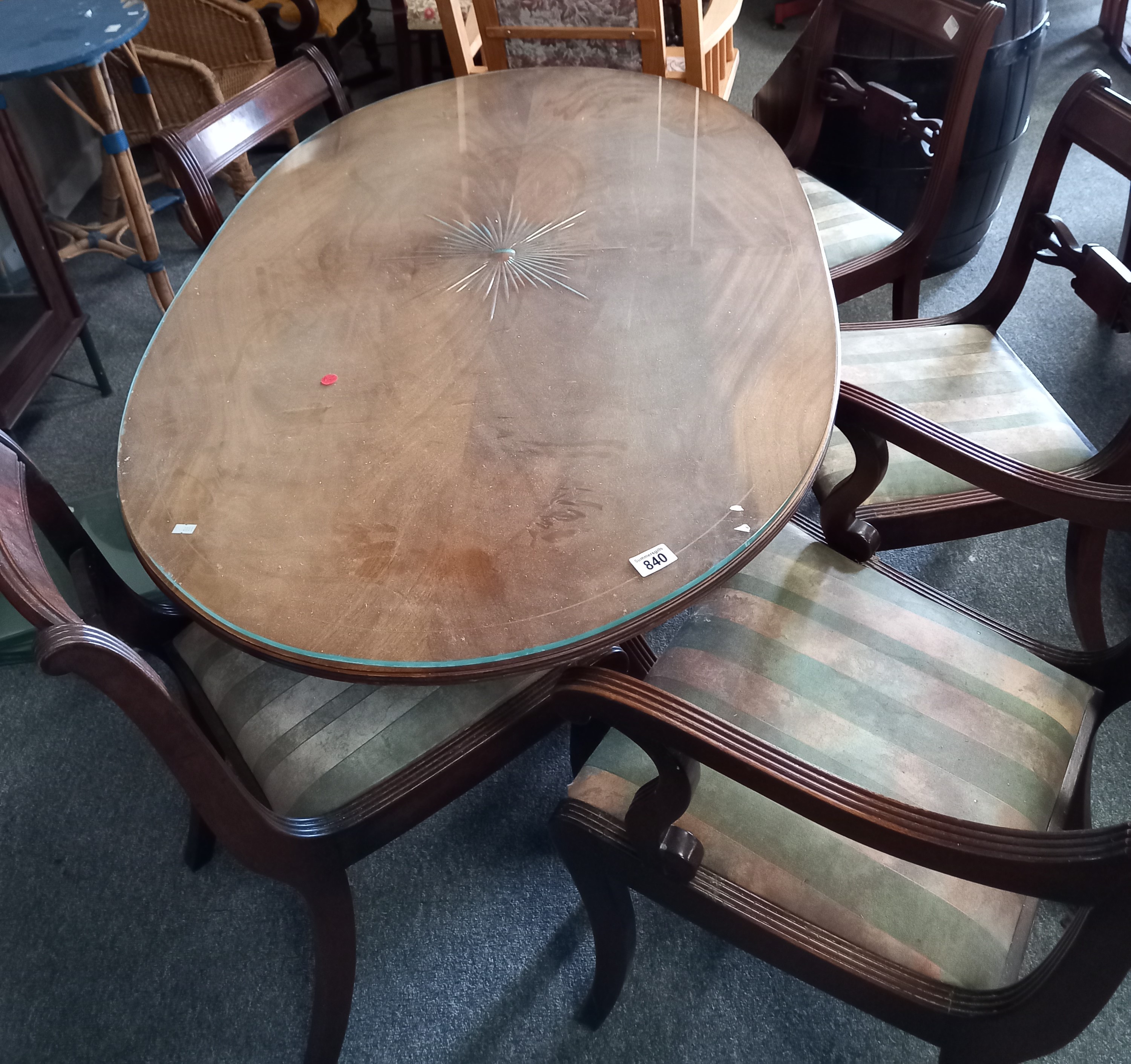 Oval Mahogany dining table on castors with 5 chairs