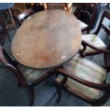 Oval Mahogany dining table on castors with 5 chairs