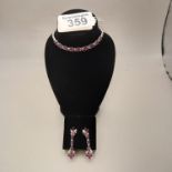18k white gold and ruby bracelet and matching earrings
