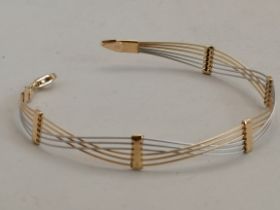 A 14k gold bracelet 5g in two tone gold