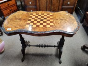 Antique burr walnut games table with carved decora