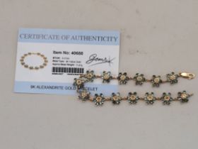 A 9 carat gold alexandrite bracelet