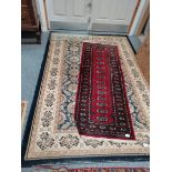 Blue and cream rug and red runner rug